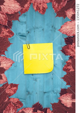 Autumn leaves with yellow note Autumn leaves with yellow note 135041272