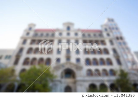 Low angle view of building with arch windows Low angle view of building with arch windows 135041386