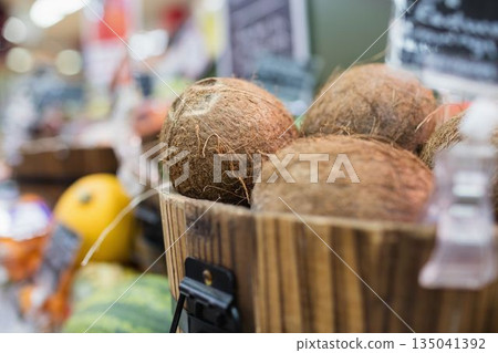 Coconuts in container at supermarket Coconuts in container at supermarket 135041392