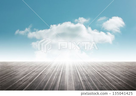 Large white cloud floating in blue sky above wooden deck in flat design, with small wisps 135041425