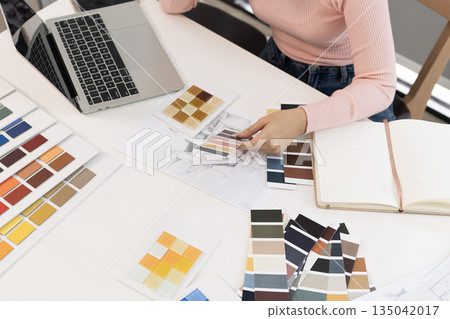 Creative web designer planning UI application and developing digital template 135042017