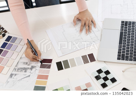 Creative web designer planning UI application and developing digital template 135042023