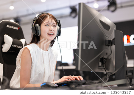Young woman enjoying games at an e-sports tournament 135043537