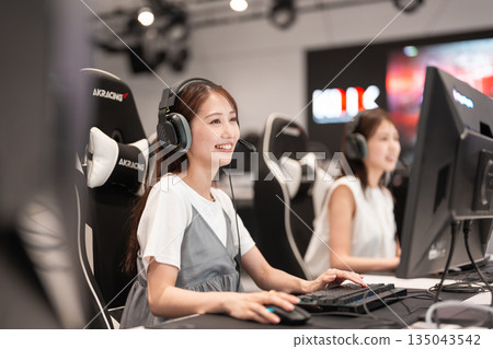 Young woman enjoying games at an e-sports tournament 135043542
