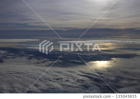 A magnificent sea of clouds seen from inside the plane 135043655