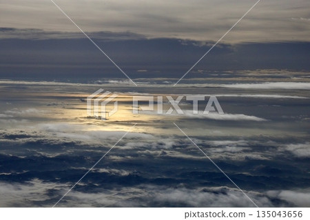 A view of the sea of clouds and the continent from inside the plane 135043656