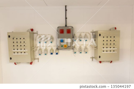 Wall-mounted electrical distribution is showing flat style with boxes, panel, sockets, cables Wall-mounted electrical distribution is showing flat style with boxes, panel, sockets, cables 135044197