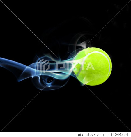 Close up of tennis ball with smoke 135044224