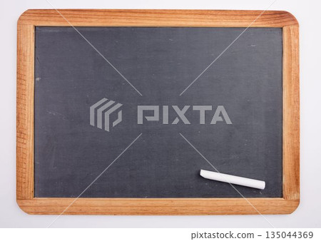 Chalkboard with piece of chalk 135044369