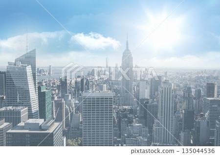 flat-design skyline is stretching art deco spire, supertall tower over glass towers under blue sky 135044536
