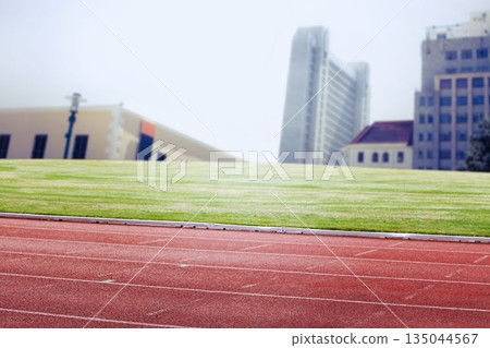 Composite image of racetrack in city Composite image of racetrack in city 135044567