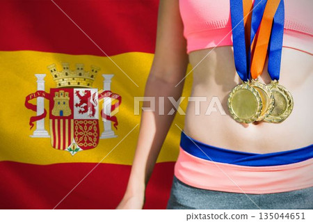 Midsection of medalist against Spanish Flag Midsection of medalist against Spanish Flag 135044651