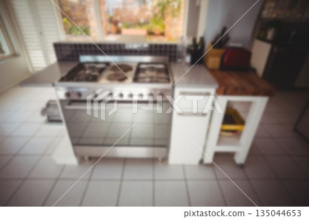 Flat design home kitchen is featuring stainless steel stove on island with red toaster, backsplash Flat design home kitchen is featuring stainless steel stove on island with red toaster, backsplash 135044653