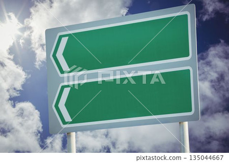 Green sign post against cloudy sky 135044667