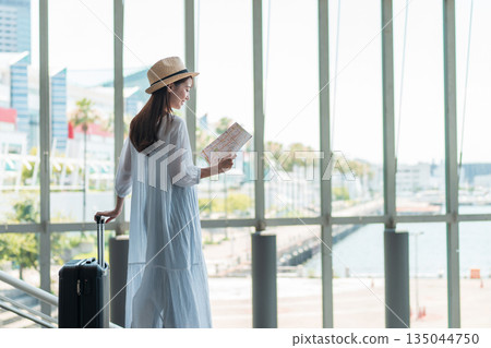 A young woman who enjoys traveling 135044750