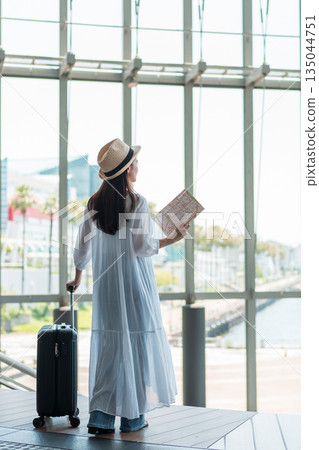 A young woman who enjoys traveling 135044751