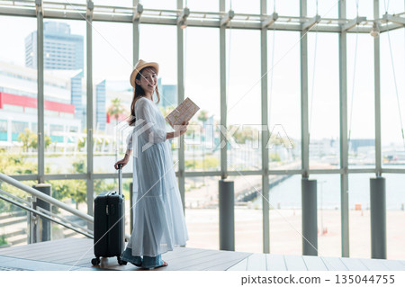 A young woman who enjoys traveling A young woman who enjoys traveling 135044755