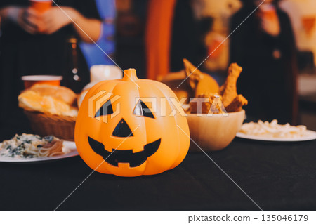 Friends enjoying a Halloween party at a bar making a toast Friends enjoying a Halloween party at a bar making a toast 135046179