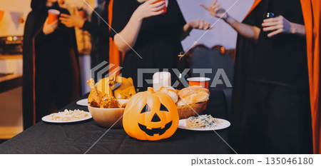 Friends enjoying a Halloween party at a bar making a toast Friends enjoying a Halloween party at a bar making a toast 135046180