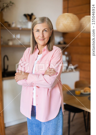 Elderly lady posing casually indoors with relaxed expression 135046914