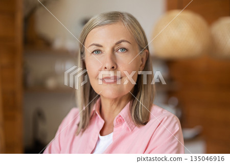 Elderly lady posing casually indoors with relaxed expression Elderly lady posing casually indoors with relaxed expression 135046916