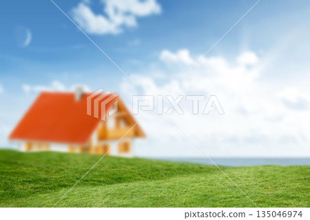 Flat design showing rolling meadow leading toward red-roofed two-story house with sea, cloudy sky Flat design showing rolling meadow leading toward red-roofed two-story house with sea, cloudy sky 135046974