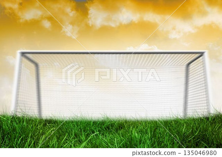 Goalpost on grass under yellow sky Goalpost on grass under yellow sky 135046980