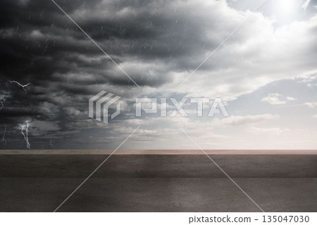 Flat design is showing gray paved surface under stormy clouds with lightning, rain and sun rays Flat design is showing gray paved surface under stormy clouds with lightning, rain and sun rays 135047030