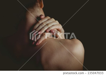 Showing woman raising hands on nape in flat illustration with manicured nails and low-key lighting Showing woman raising hands on nape in flat illustration with manicured nails and low-key lighting 135047033