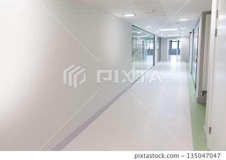 Flat design corridor is stretching into distance with glass panels, doors, radiator, exit sign Flat design corridor is stretching into distance with glass panels, doors, radiator, exit sign 135047047