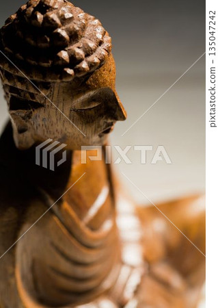 High angle view of wooden Buddha statue on floor 135047242