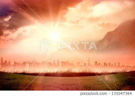 Flat design sun is radiating over grass field with modern skyline, misty mountain and tinted clouds 135047364