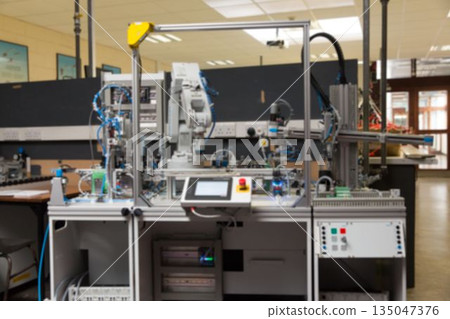 Showing flat design 6-axis robot arm in lab featuring safety frame touchscreen console and sensors Showing flat design 6-axis robot arm in lab featuring safety frame touchscreen console and sensors 135047376