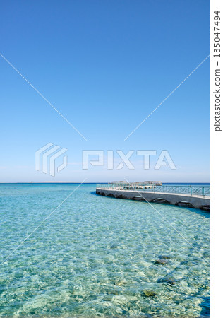 Concrete pier at the beach in Hurghada, Egypt. Concrete pier at the beach in Hurghada, Egypt. 135047494