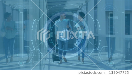 Walking travelers pulling suitcase and carrying shoulder bag in airport, with digital overlay Walking travelers pulling suitcase and carrying shoulder bag in airport, with digital overlay 135047735