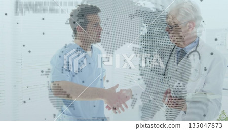 Staff wearing scrubs and coat discussing map at glass panel in clinic, with tablet and stethoscope Staff wearing scrubs and coat discussing map at glass panel in clinic, with tablet and stethoscope 135047873