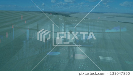 Analyzing businessman reviewing charts on panels in control room, with bar arrow icon Analyzing businessman reviewing charts on panels in control room, with bar arrow icon 135047890