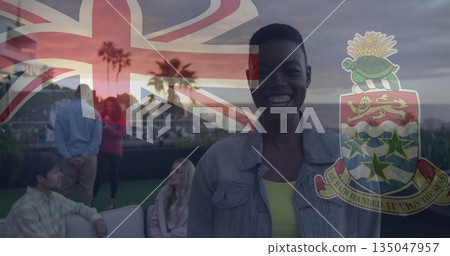 Smiling man in denim jacket on rooftop lounge, with flag and coat-of-arms overlay, copy space 135047957