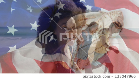 Blending smiling Black woman in red top with baseball glove holding ball under US flag overlay Blending smiling Black woman in red top with baseball glove holding ball under US flag overlay 135047966