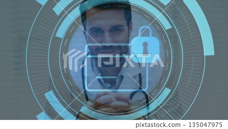 Standing male doctor presenting secure records on digital interface in clinic, with padlock icon 135047975