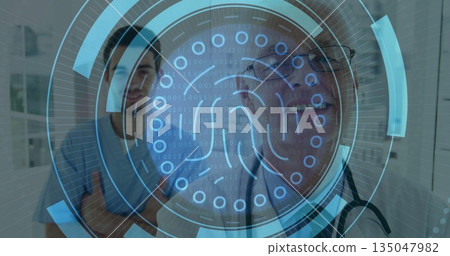 Displaying fingerprint hologram at clinic, with doctor wearing stethoscope and patient observing 135047982
