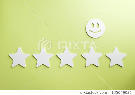 Five star customer feedback review shows excellent satisfaction rating for business service, online survey represents positive experience with cheerful smiley face on a vibrant green background 135049025