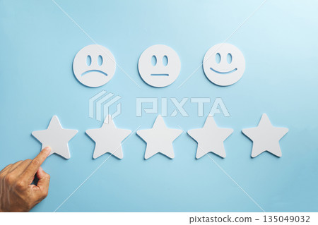 Survey for customer rate satisfaction experience comparing service quality options, hand selecting one star to convey poor feedback and demonstrate low review concept Survey for customer rate satisfaction experience comparing service quality options, hand selecting one star to convey poor feedback and demonstrate low review concept 135049032