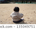 Back view of a baby boy relaxing in nature 135049751
