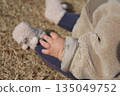 Close-up of a baby's plump arms (tear bread) 135049752