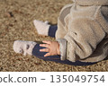 Close-up of a baby's plump arms (tear bread) 135049754