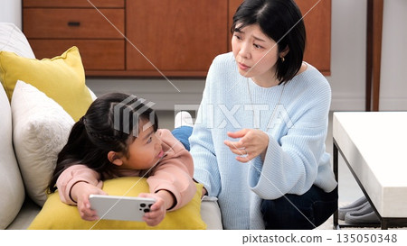 Parent-child quarrel, smartphone, long hours of gaming, studying image Parent-child quarrel, smartphone, long hours of gaming, studying image 135050348