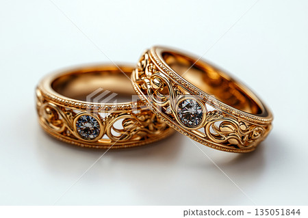 Luxury pair of Wedding Rings on a white background. Rococo Renaissance style. Luxury pair of Wedding Rings on a white background. Rococo Renaissance style. 135051844