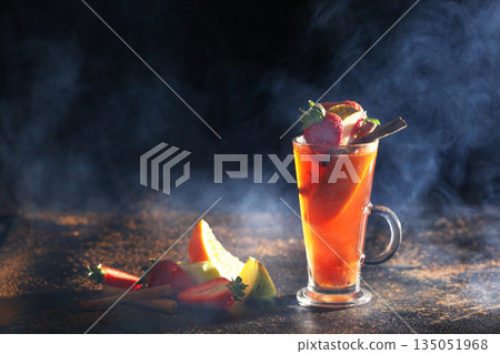 Healthy tea for winter. Hot orange tea with cinnamon. A warming drink. Vitamin C. Healthy tea for winter. Hot orange tea with cinnamon. A warming drink. Vitamin C. 135051968