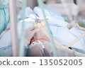 An elderly man undergoing surgery. General anesthesia. Preparing the patient for surgery. Introduction to anesthesia. A breathing mask on the face of an elderly man. 135052005